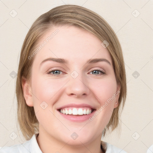 Joyful white young-adult female with medium  brown hair and blue eyes