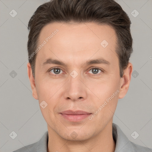 Joyful white adult male with short  brown hair and brown eyes