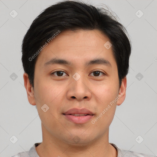 Joyful asian young-adult male with short  brown hair and brown eyes