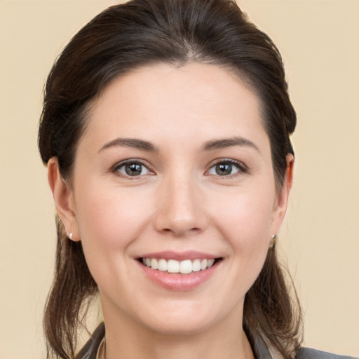 Joyful white young-adult female with medium  brown hair and brown eyes