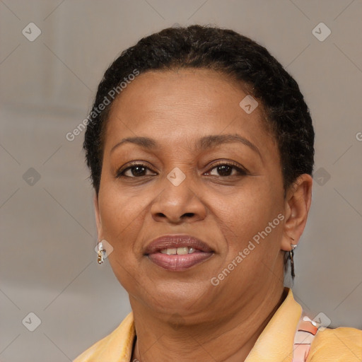 Joyful latino adult female with short  brown hair and brown eyes