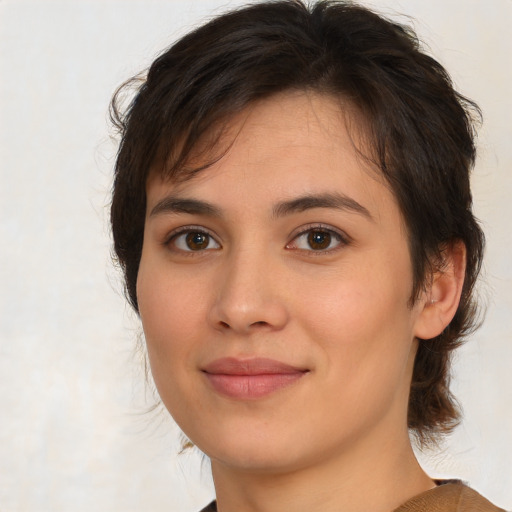 Joyful white young-adult female with medium  brown hair and brown eyes