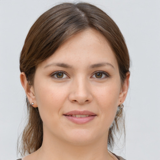 Joyful white young-adult female with medium  brown hair and brown eyes