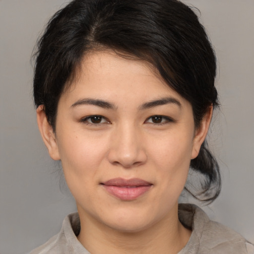 Joyful white young-adult female with medium  brown hair and brown eyes