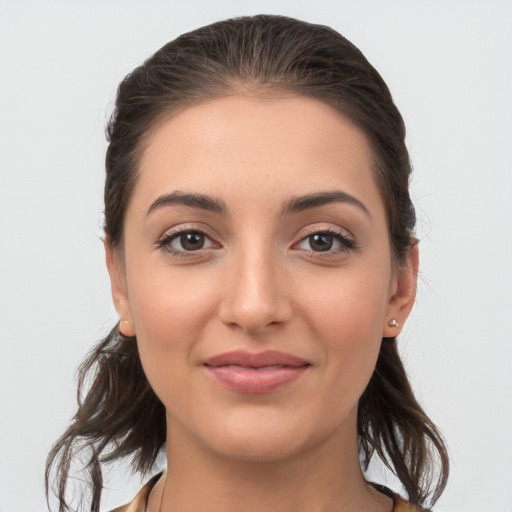 Joyful white young-adult female with medium  brown hair and brown eyes