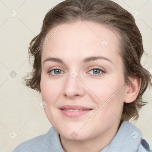 Joyful white young-adult female with medium  brown hair and blue eyes