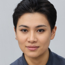 Joyful asian young-adult female with short  brown hair and brown eyes