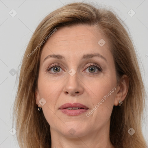 Joyful white adult female with long  brown hair and brown eyes