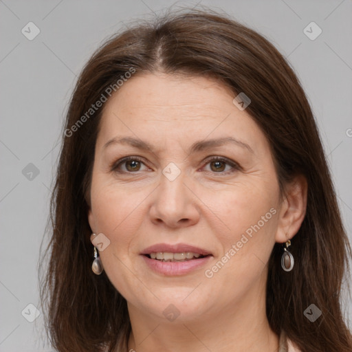 Joyful white adult female with medium  brown hair and grey eyes