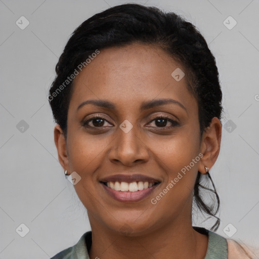 Joyful latino young-adult female with long  brown hair and brown eyes