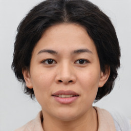 Joyful asian young-adult female with medium  brown hair and brown eyes