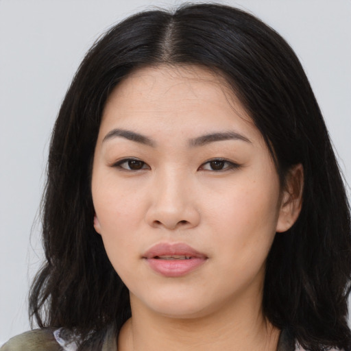 Joyful asian young-adult female with medium  brown hair and brown eyes