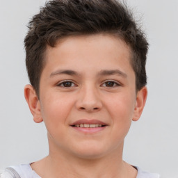 Joyful white child male with short  brown hair and brown eyes