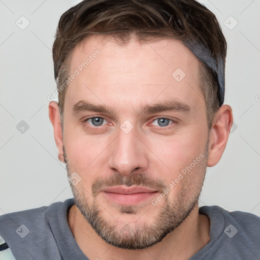 Neutral white young-adult male with short  brown hair and grey eyes