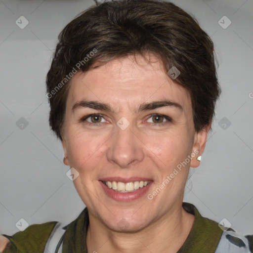 Joyful white adult female with medium  brown hair and green eyes