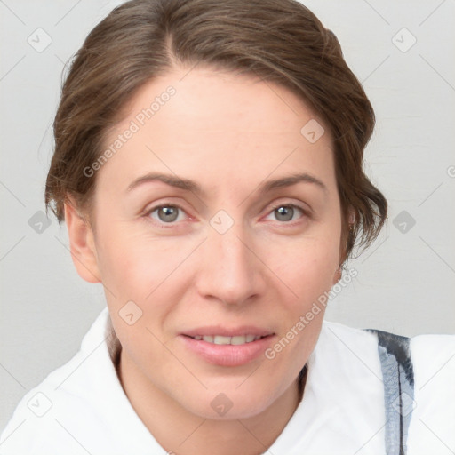 Joyful white adult female with short  brown hair and grey eyes