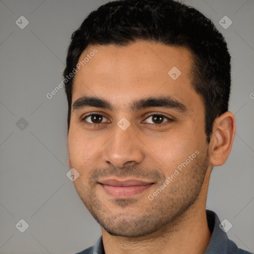 Joyful latino young-adult male with short  black hair and brown eyes