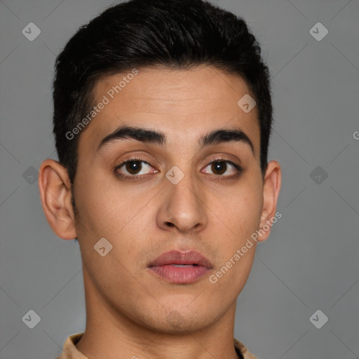 Joyful latino young-adult male with short  brown hair and brown eyes