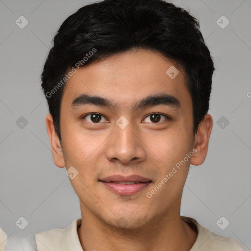 Joyful asian young-adult male with short  black hair and brown eyes