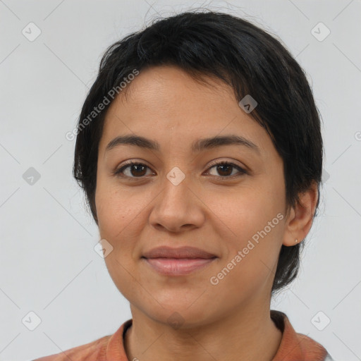 Joyful latino young-adult female with short  brown hair and brown eyes