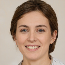 Joyful white young-adult female with medium  brown hair and brown eyes