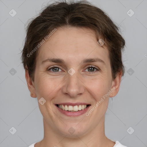 Joyful white adult female with short  brown hair and brown eyes