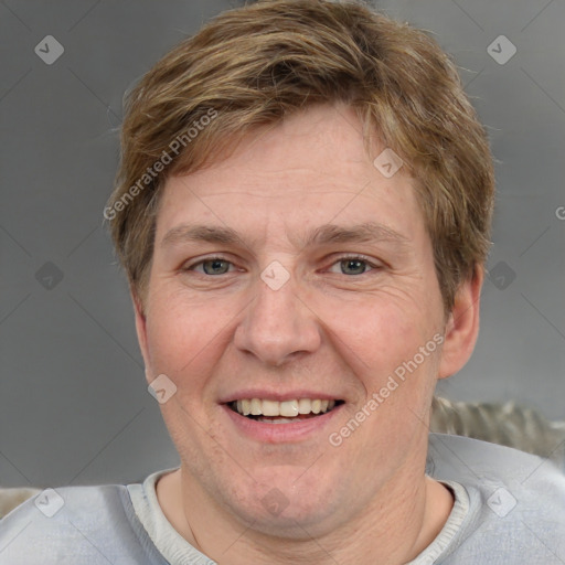 Joyful white adult male with short  brown hair and grey eyes