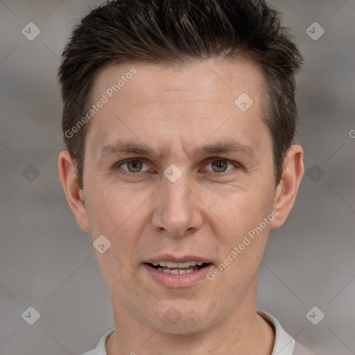 Joyful white adult male with short  brown hair and brown eyes