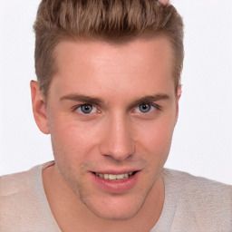 Joyful white young-adult male with short  brown hair and blue eyes