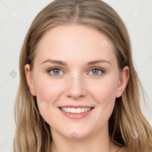 Joyful white young-adult female with long  brown hair and grey eyes