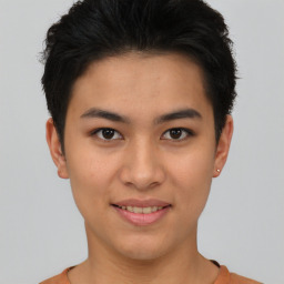 Joyful asian young-adult female with short  brown hair and brown eyes