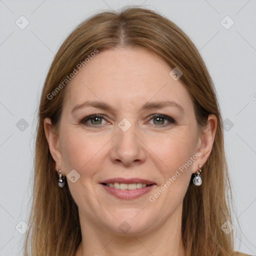 Joyful white adult female with long  brown hair and grey eyes