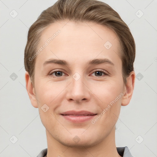 Joyful white young-adult female with short  brown hair and grey eyes