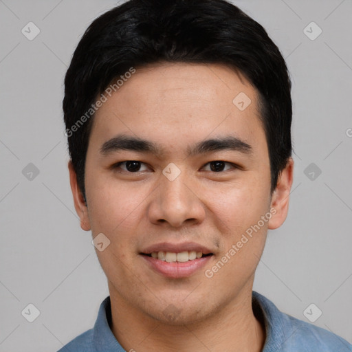 Joyful asian young-adult male with short  black hair and brown eyes