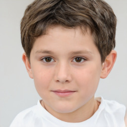 Joyful white child male with short  brown hair and brown eyes