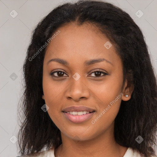 Joyful black young-adult female with long  brown hair and brown eyes