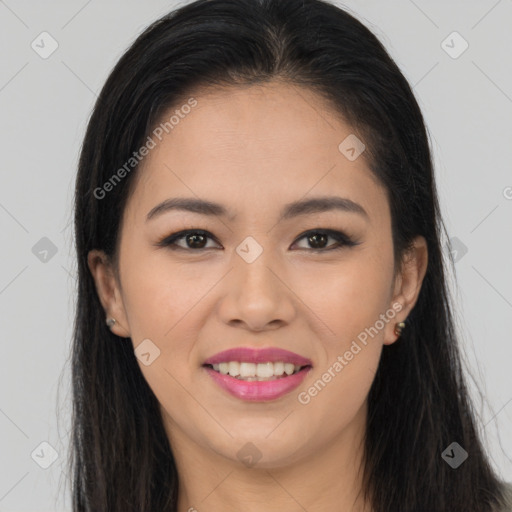 Joyful latino young-adult female with long  brown hair and brown eyes