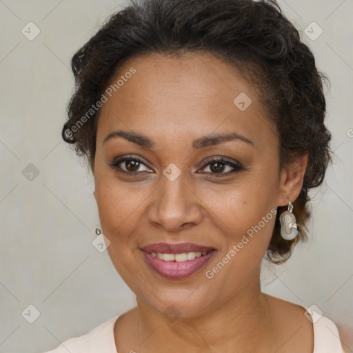 Joyful black adult female with medium  brown hair and brown eyes