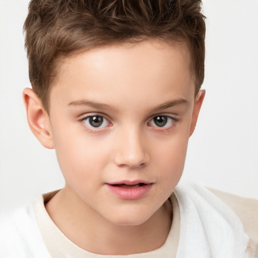 Joyful white child male with short  brown hair and brown eyes