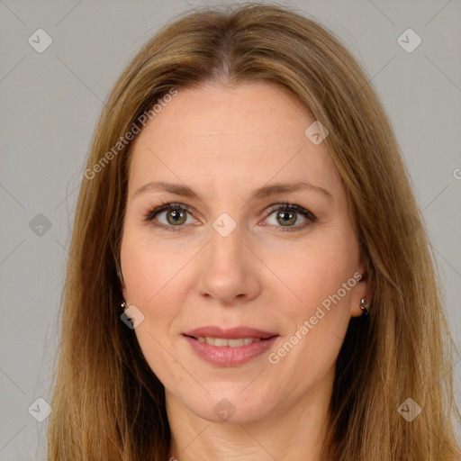 Joyful white adult female with long  brown hair and brown eyes