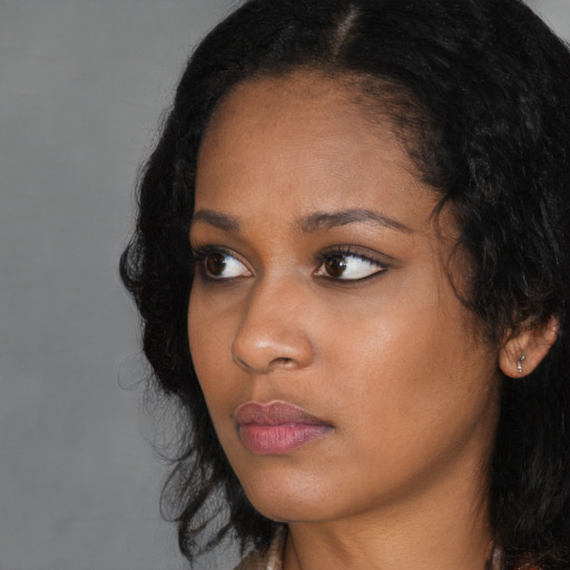Neutral black young-adult female with long  black hair and brown eyes