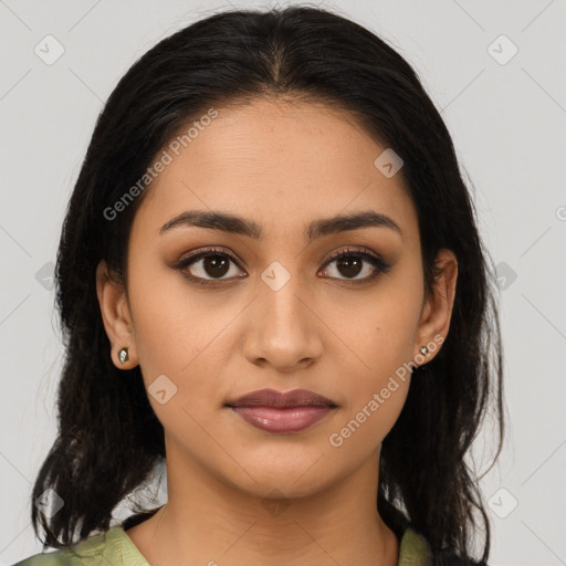 Joyful latino young-adult female with medium  brown hair and brown eyes