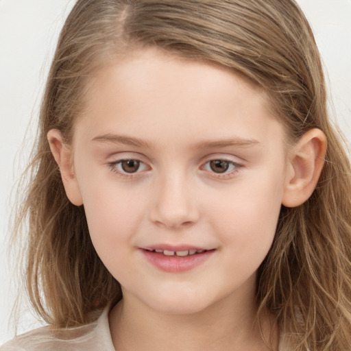 Joyful white child female with long  brown hair and brown eyes