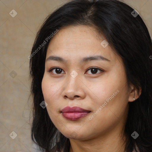 Joyful asian young-adult female with long  brown hair and brown eyes