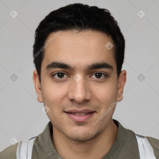 Joyful white young-adult male with short  black hair and brown eyes