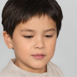 Joyful white child male with short  brown hair and brown eyes