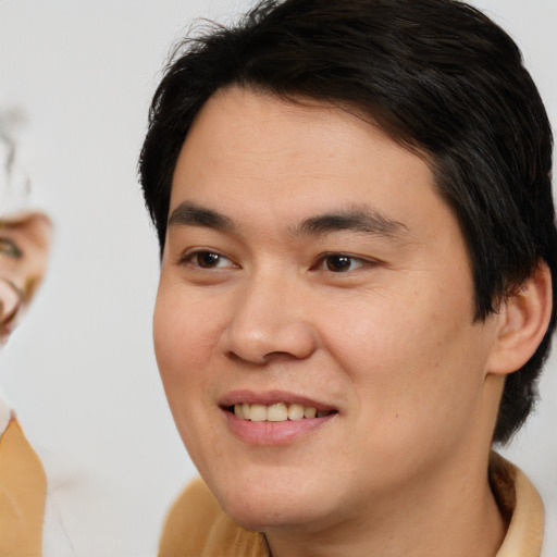 Joyful white young-adult male with medium  brown hair and brown eyes