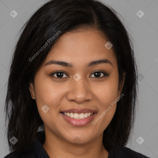 Joyful latino young-adult female with long  brown hair and brown eyes