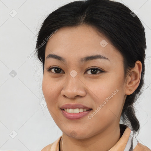 Joyful asian young-adult female with medium  brown hair and brown eyes