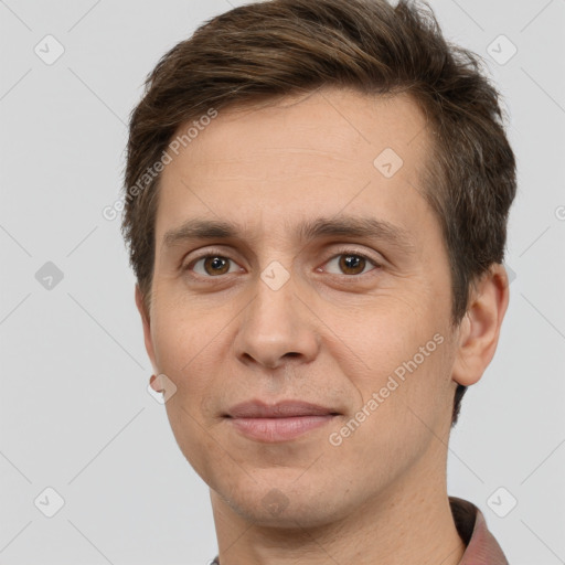 Joyful white adult male with short  brown hair and brown eyes